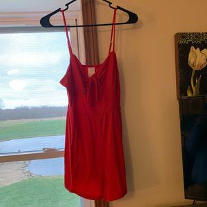 Red spaghetti strap romper with bow front